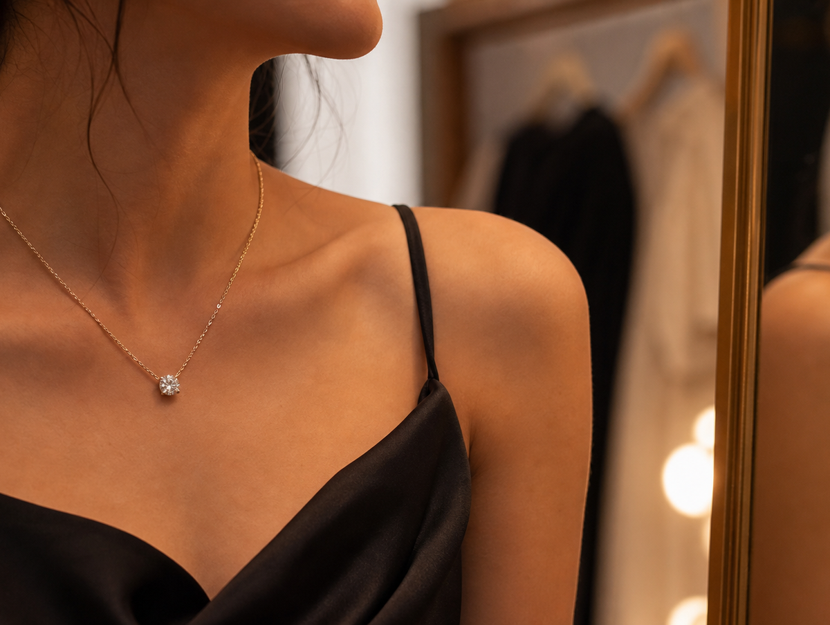 Lab-grown diamond necklace worn with an evening neckline under warm event-prep lighting.