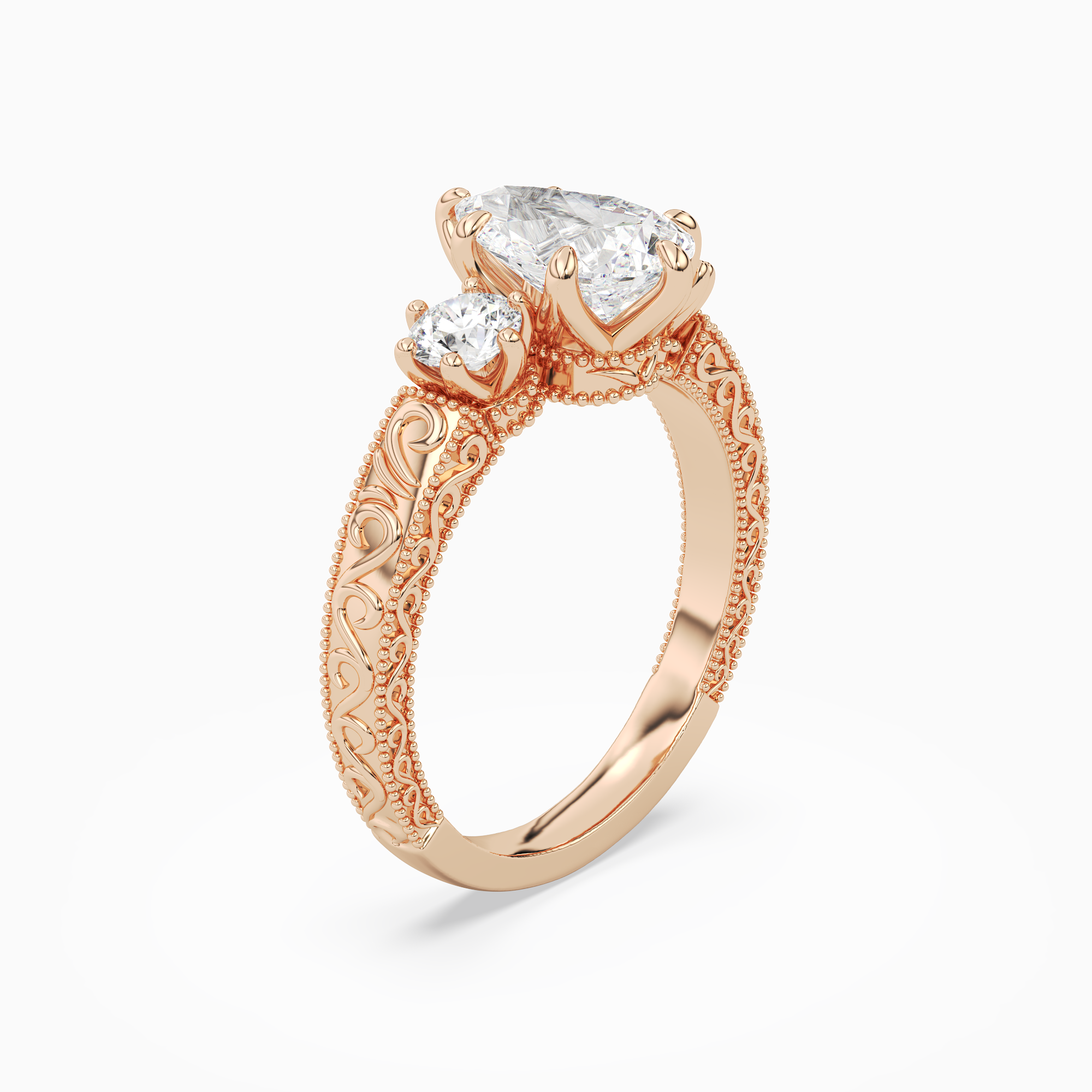 Pear Engraved Vintage Three Stone in 14K Rose Gold angled