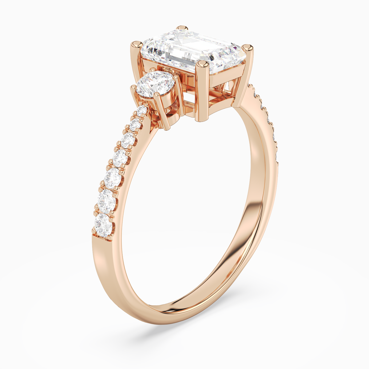 Emerald Classic Round Three Stone Pavé in 14K Rose Gold angled