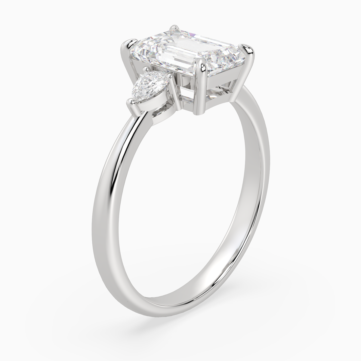 Emerald Pear Side Three Stone Classic in 14K White Gold angled