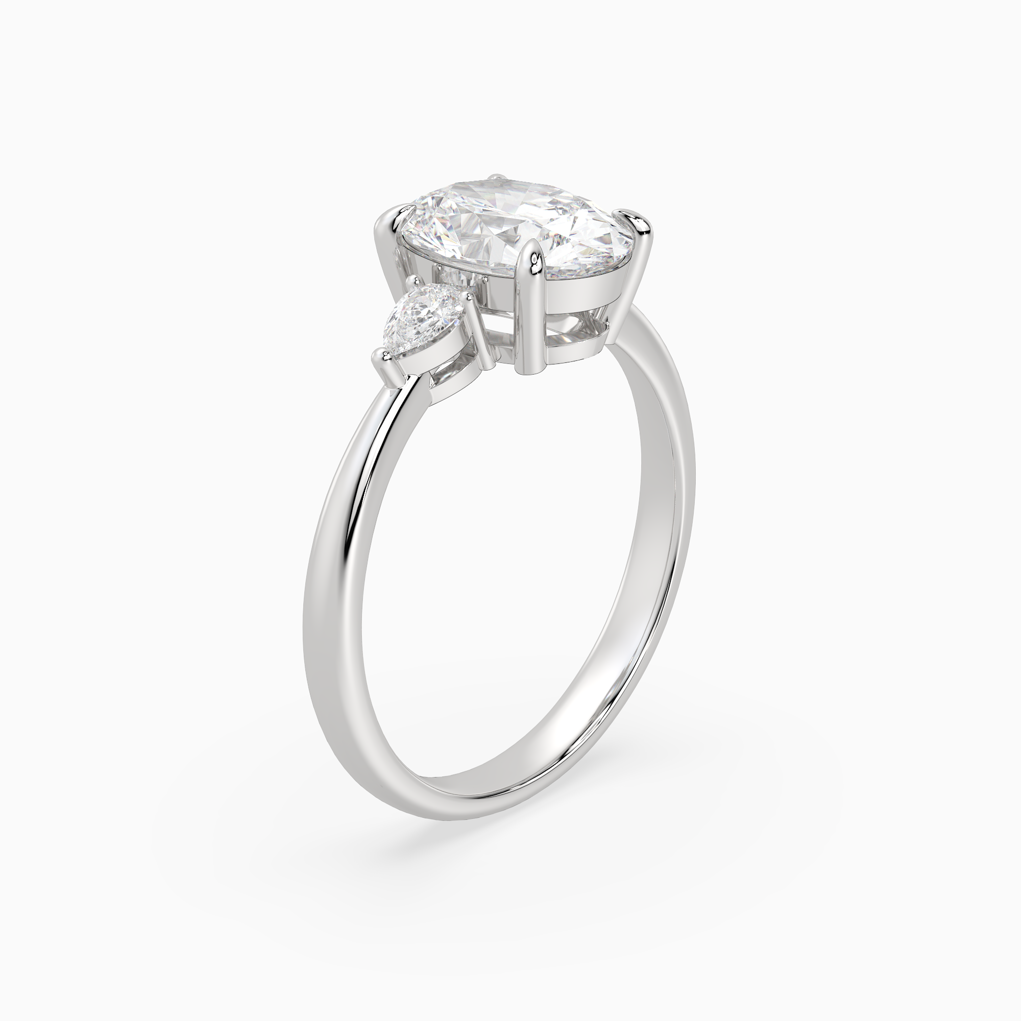Oval Pear Side Three Stone Classic in 18K White Gold angled