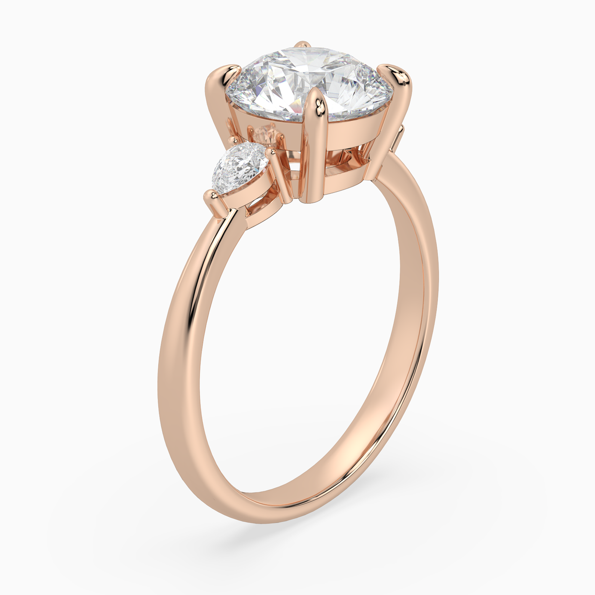 Round Pear Side Three Stone Classic in 14K Rose Gold angled