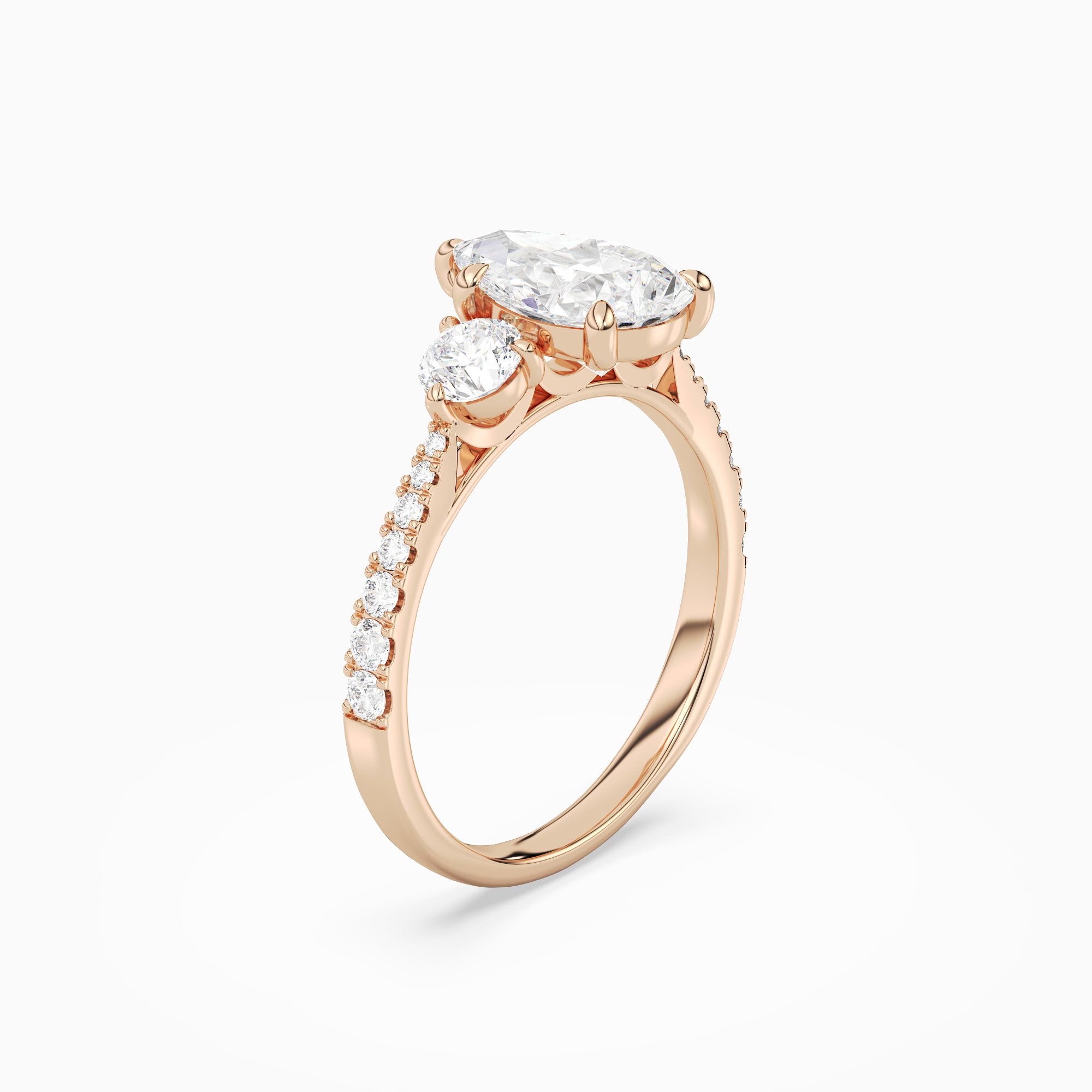 Pear Round Side Three Stone Pavé in 14K Rose Gold angled
