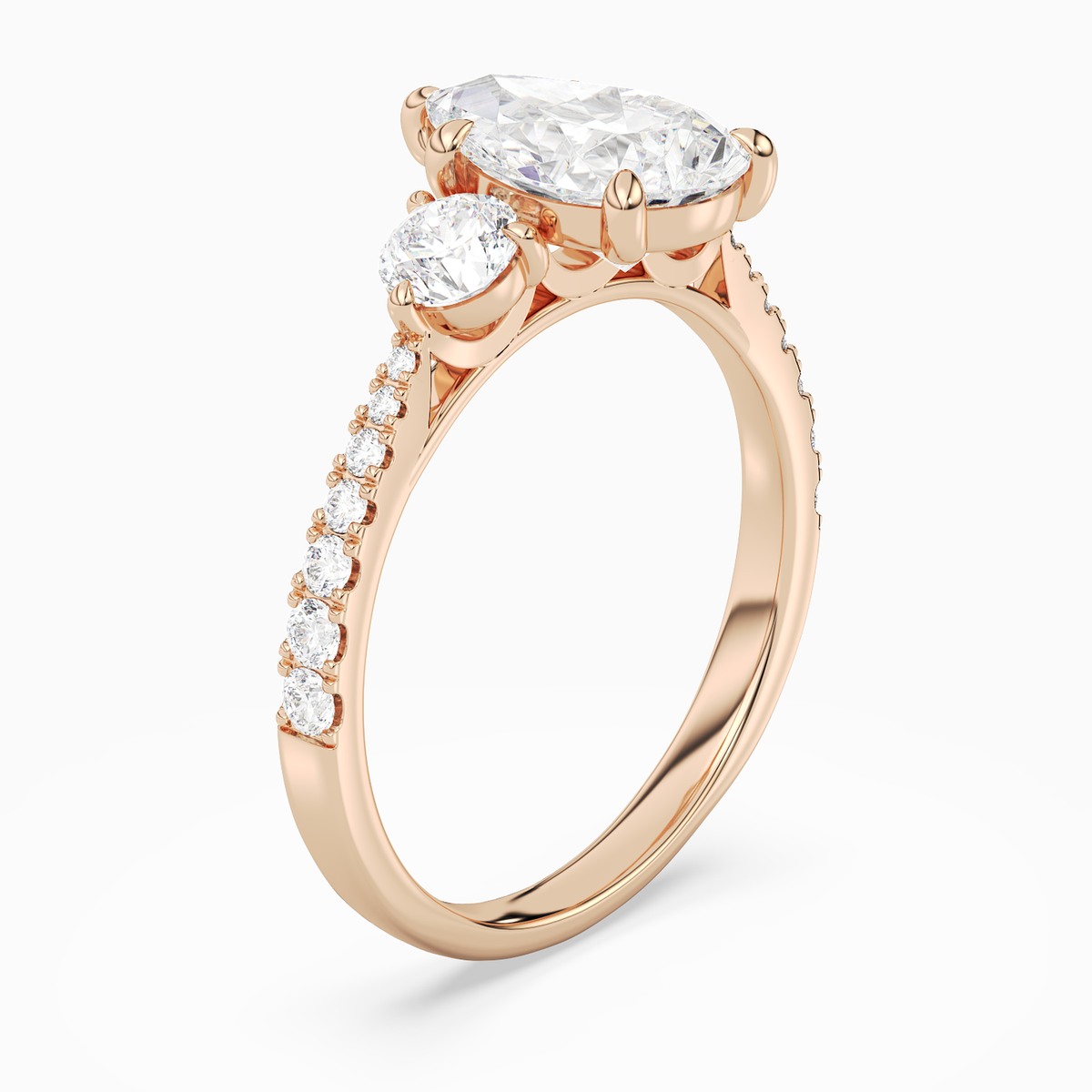 Pear Round Side Three Stone Pavé in 14K Rose Gold angled