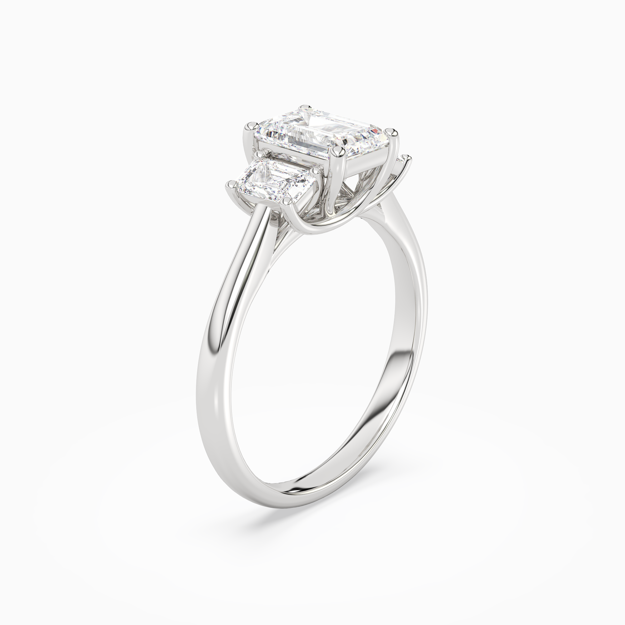 Emerald Emerald Three-Stone with Step-Cut Sides in Platinum angled