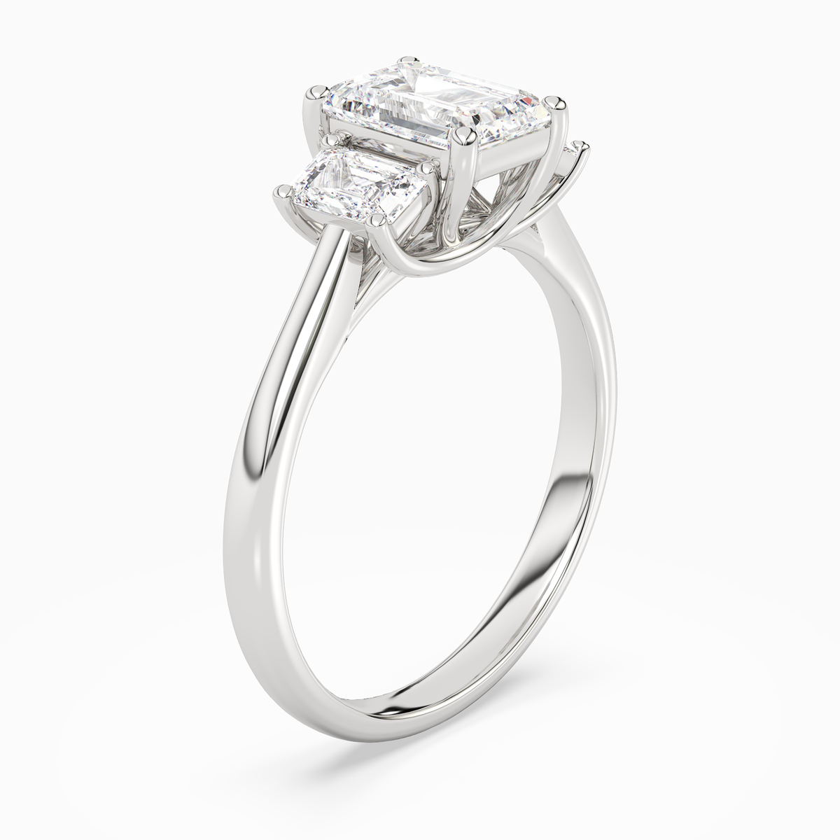 Emerald Emerald Three-Stone with Step-Cut Sides in Platinum angled