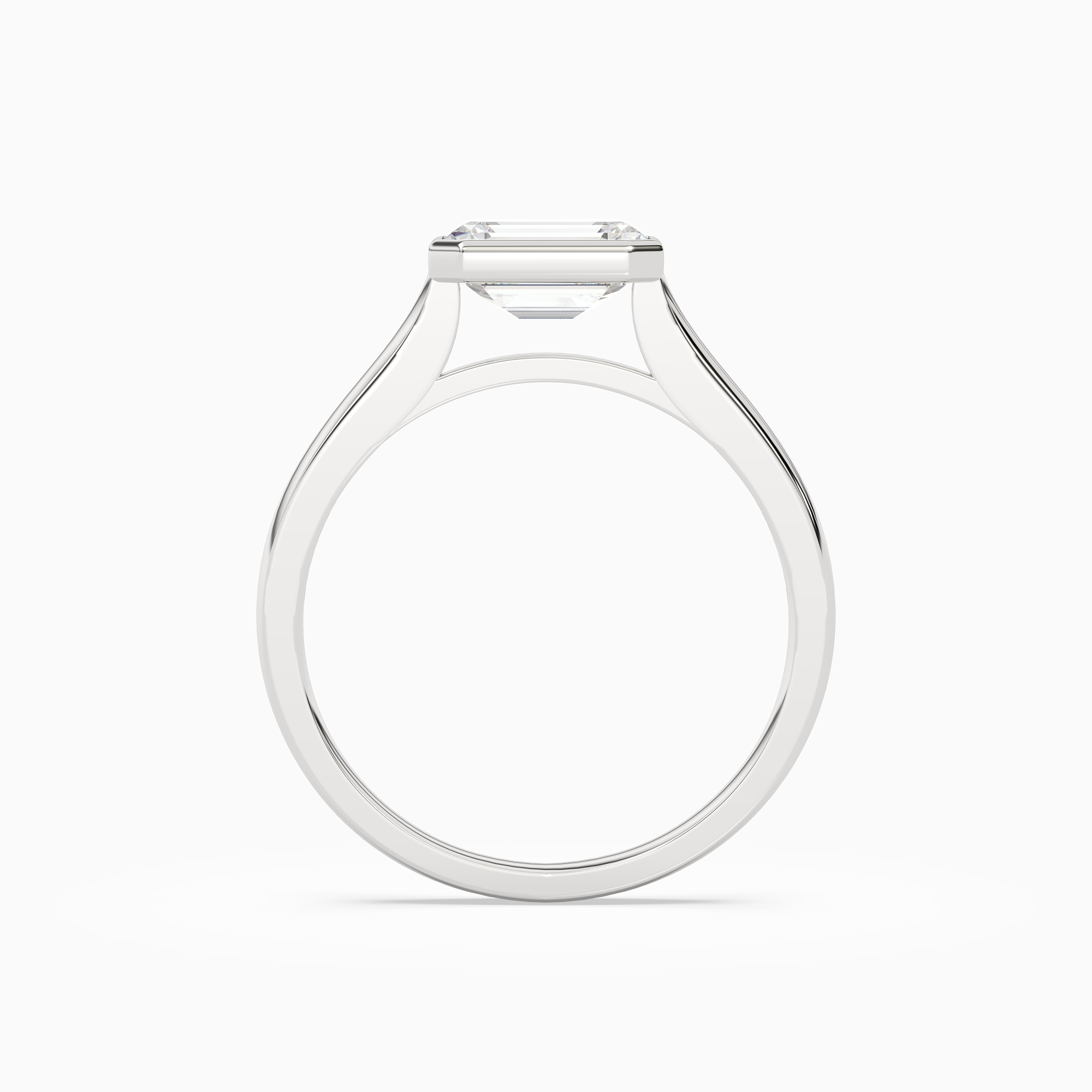 Emerald East-West Bezel Solitaire in 18K White Gold side profile