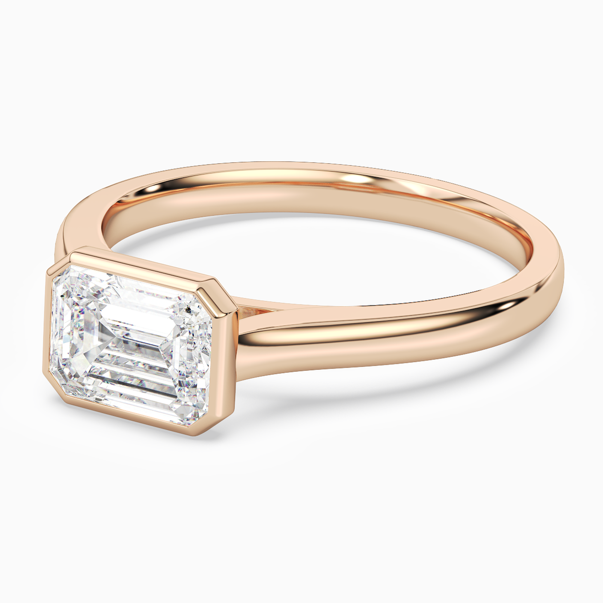 Emerald East-West Bezel Solitaire in 14K Rose Gold top angle
