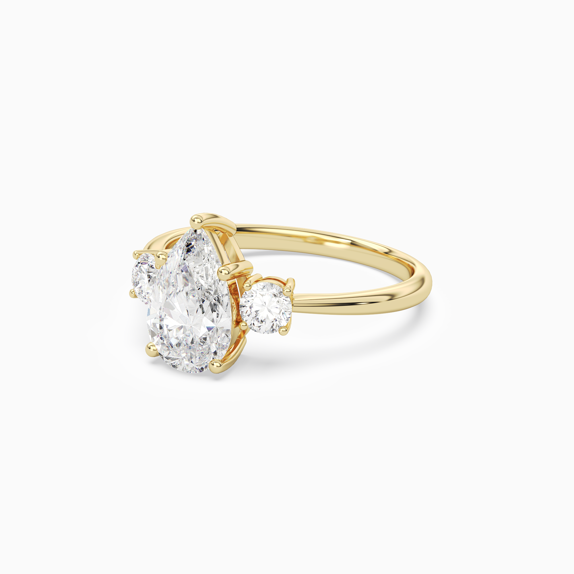 Pear Classic Round Three Stone Large Sides in 14K Yellow Gold top angle