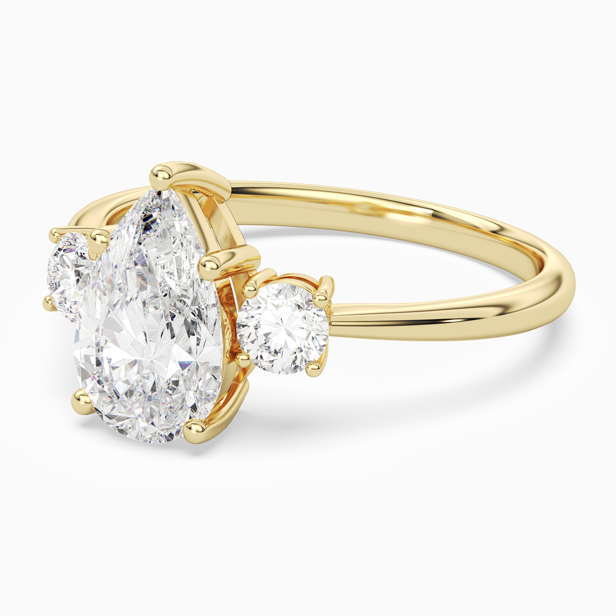 Pear Classic Round Three Stone Large Sides in 14K Yellow Gold top angle
