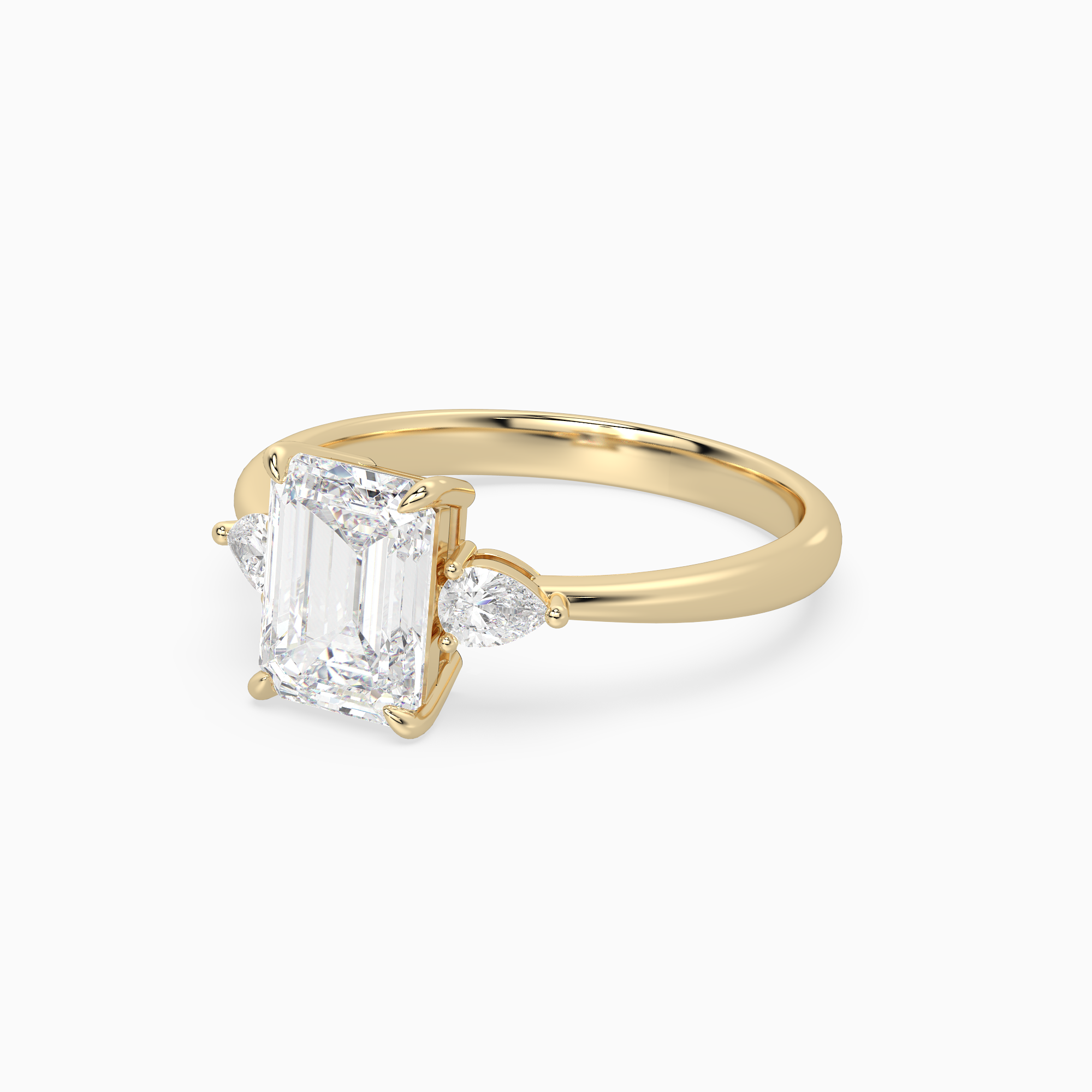 Emerald Pear Side Three Stone Classic in 18K Yellow Gold top angle
