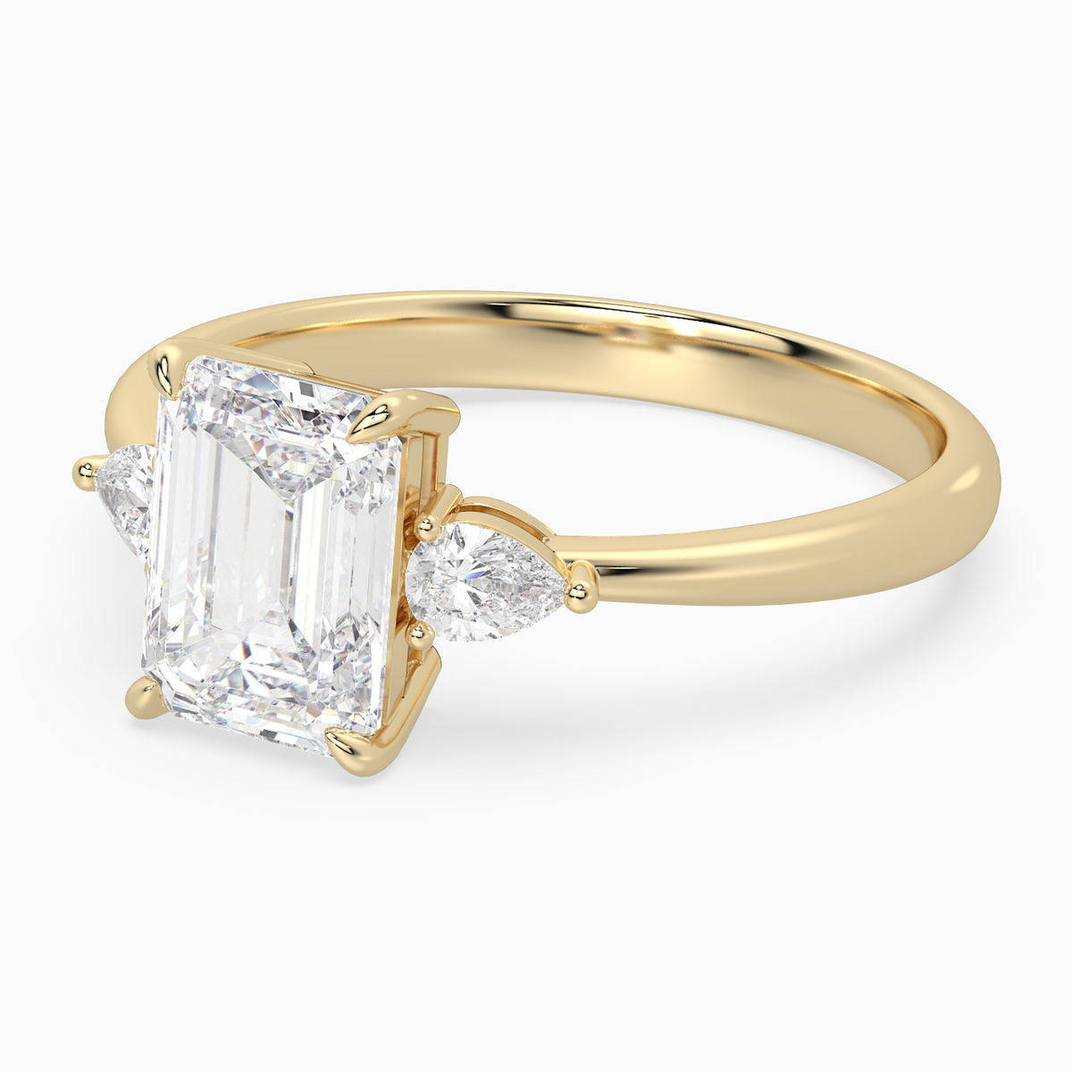Emerald Pear Side Three Stone Classic in 18K Yellow Gold top angle