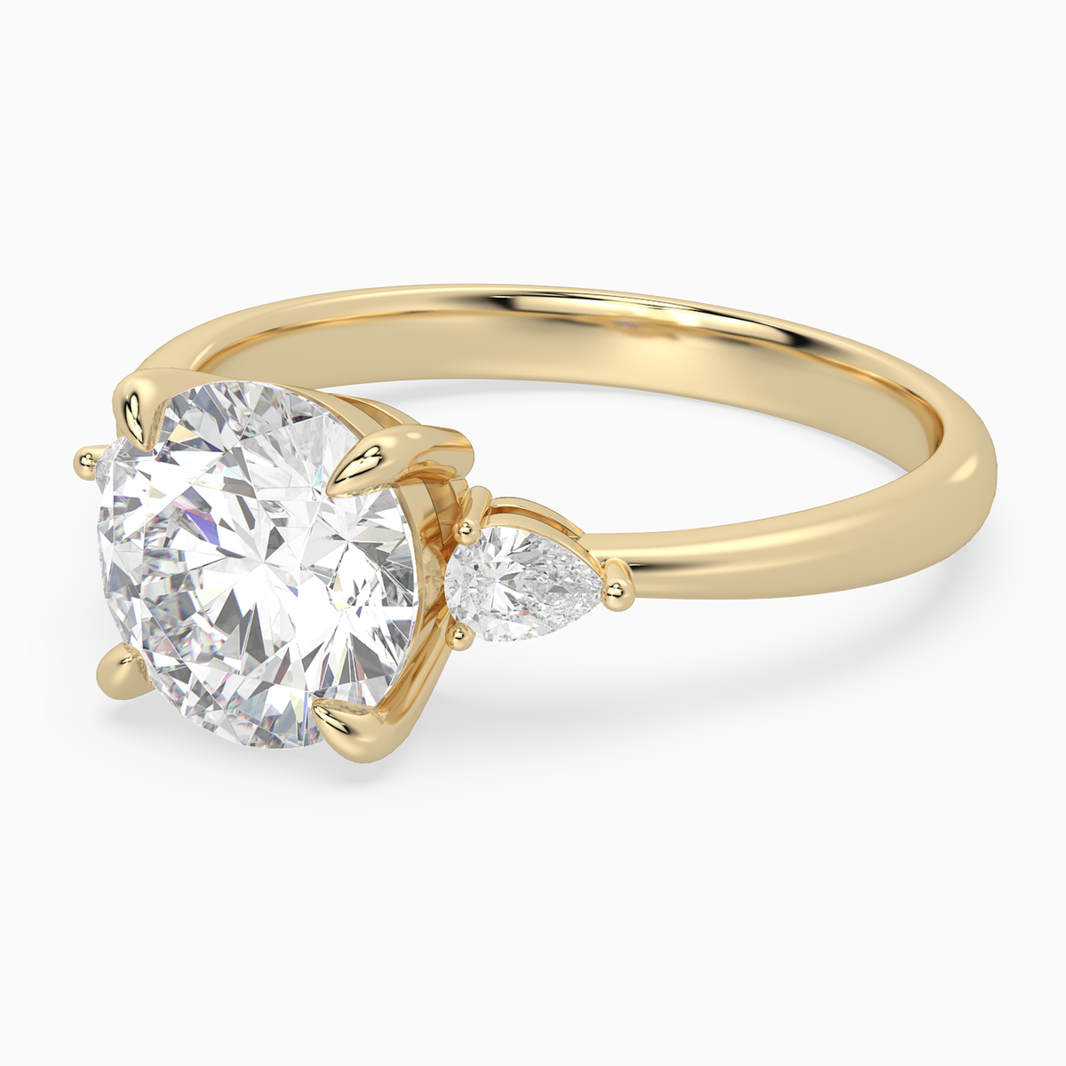 Round Pear Side Three Stone Classic in 14K Yellow Gold top angle