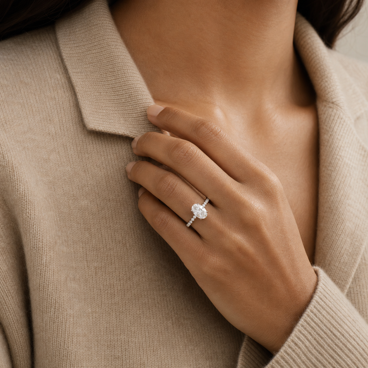 Oval Accent Shoulder Solitaire in Platinum wearing