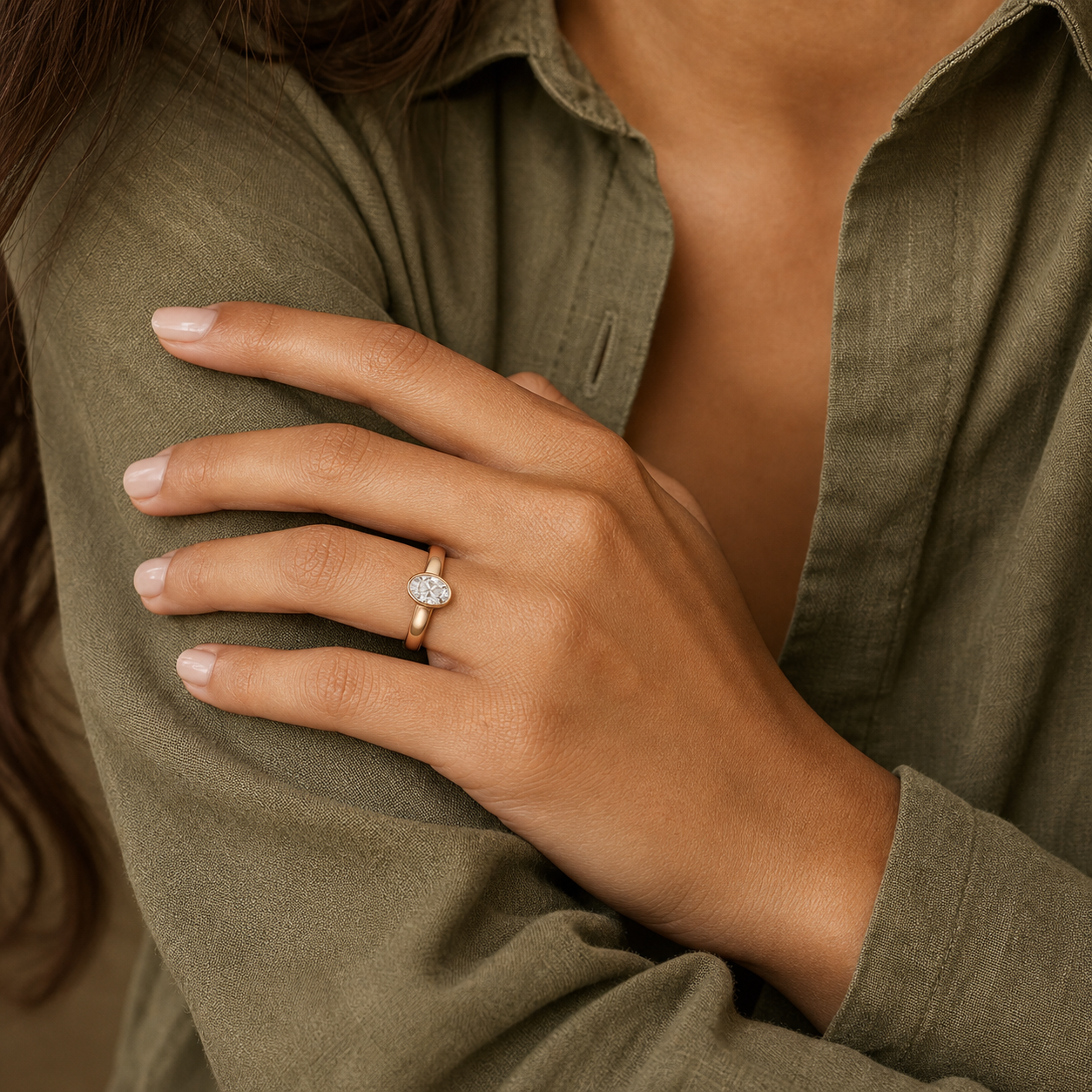 Oval Wide Tapered Bezel Solitaire in 14K Rose Gold wearing