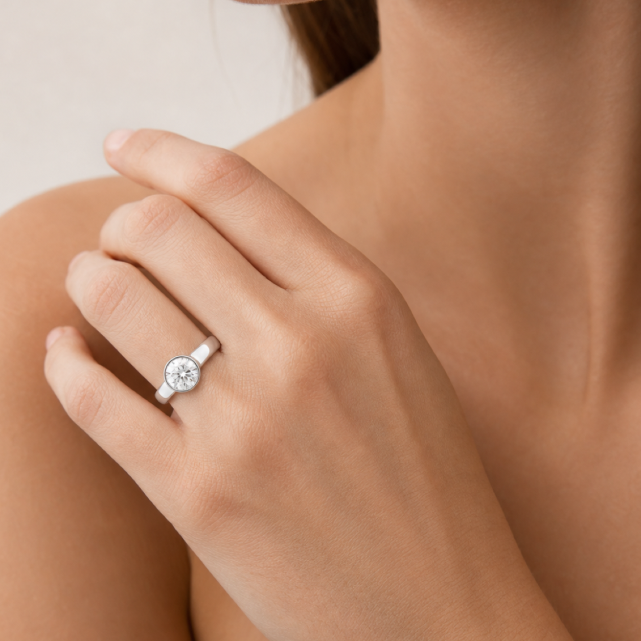Round Wide Tapered Bezel Solitaire in Platinum wearing