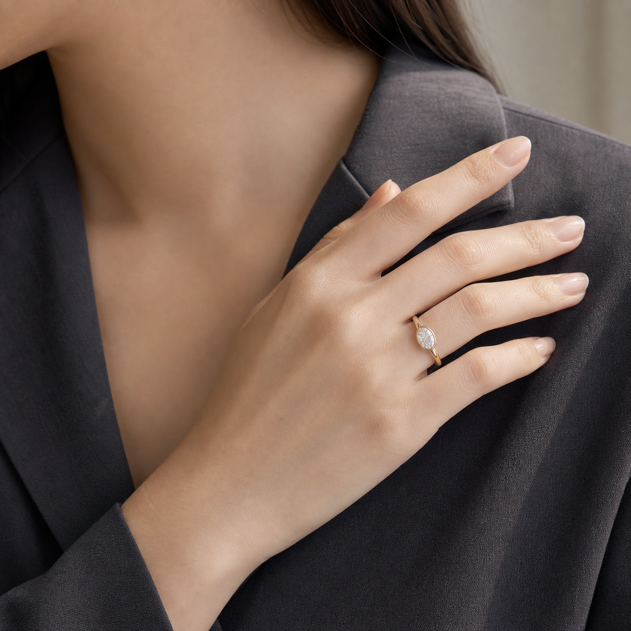 Oval East-West Bezel Solitaire in 18K Yellow Gold wearing