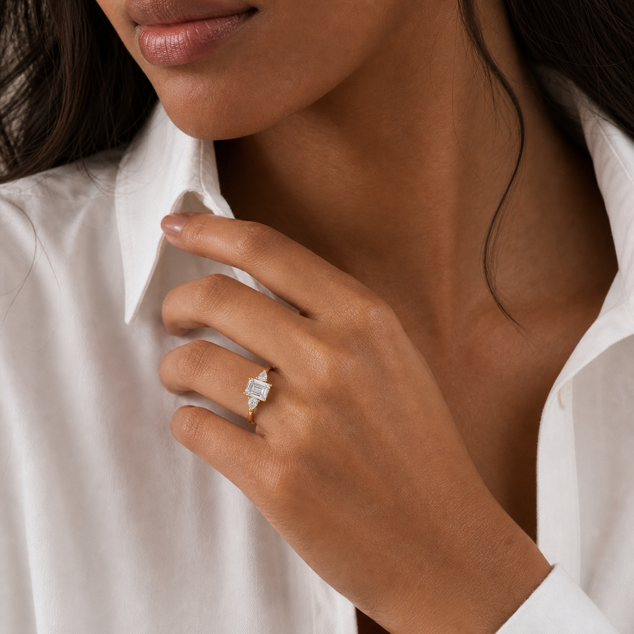 Emerald Pear Side Three Stone Classic in 18K Yellow Gold wearing