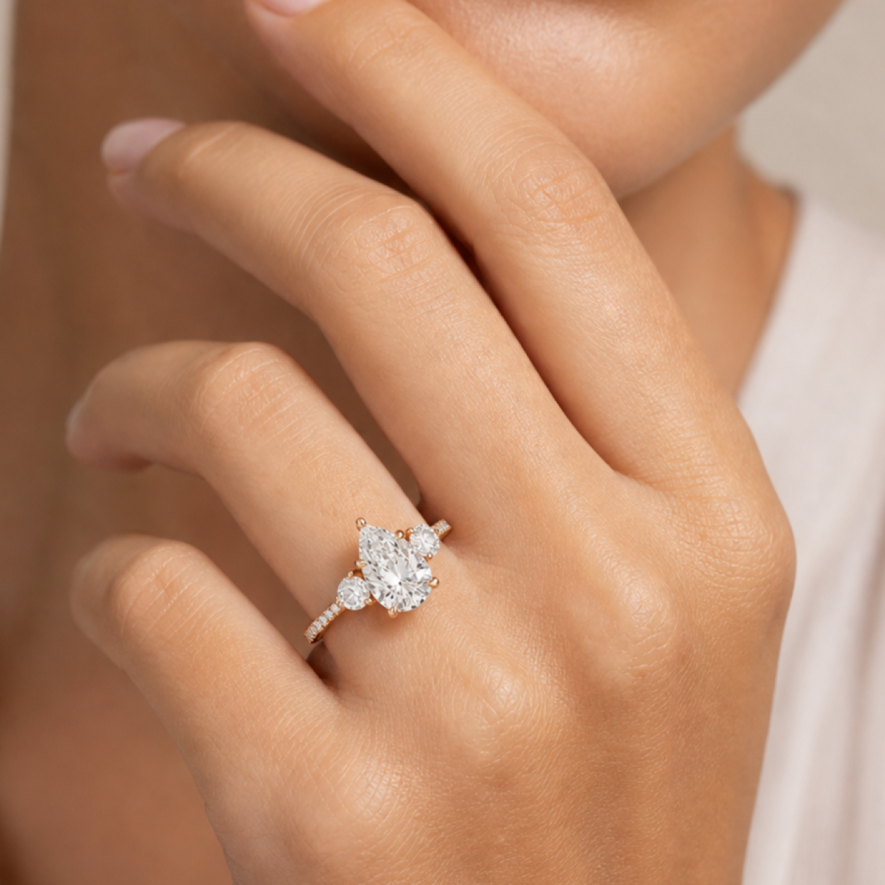 Pear Round Side Three Stone Pavé in 14K Rose Gold wearing
