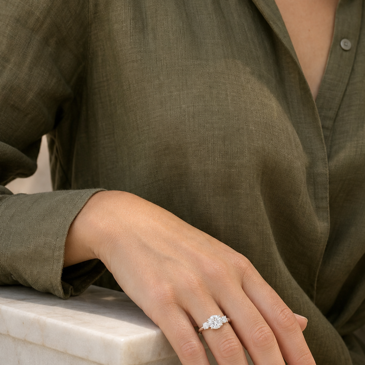 Round Round Three-Stone with Pear Sides in 18K White Gold wearing