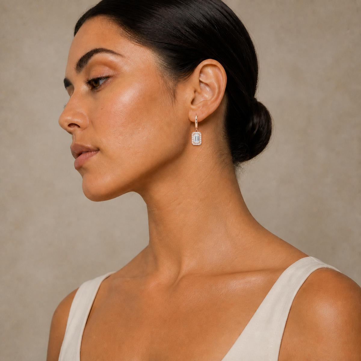 Allegra Emerald Halo Drop Huggie Hoop Lab-Grown Diamond Earrings in 14K Rose Gold, worn on ear