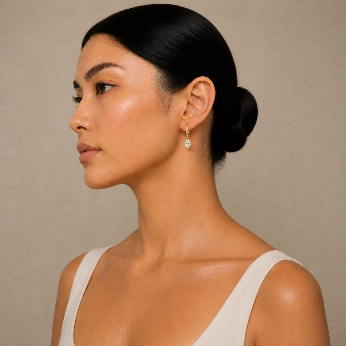 Cerelia Oval Solitaire Drop Huggie Hoop Lab-Grown Diamond Earrings in 14K Yellow Gold, worn on ear