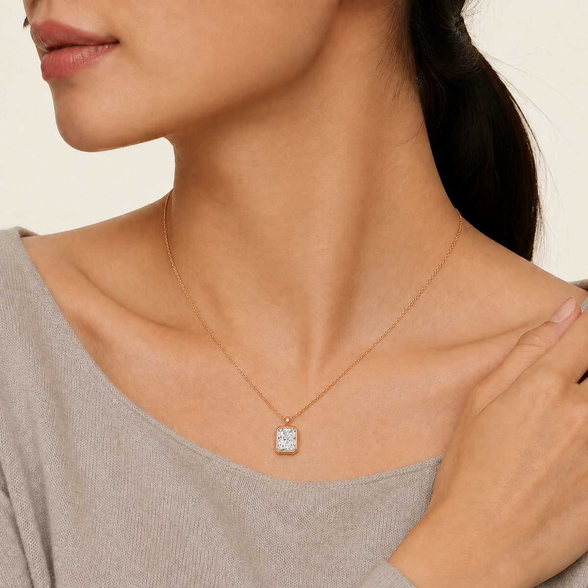 Stellaire Radiant Bezel Solitaire Lab-Grown Diamond Pendant Necklace in 14K Rose Gold, worn on neck