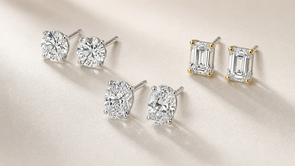 Lab-grown diamond stud earring pairs arranged in round, oval, and emerald styles.