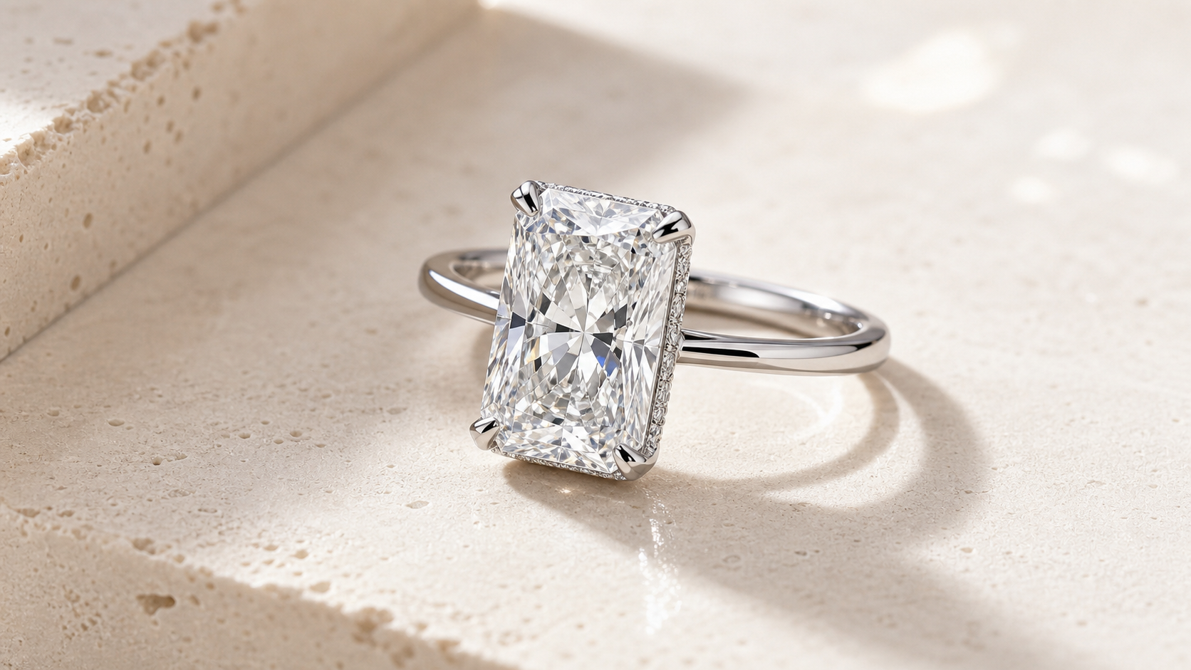 Radiant cut lab diamond engagement ring with a dimensional rectangular center stone.