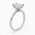 Emerald Petite Classic Solitaire in Platinum angled