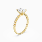 Emerald Accent Shoulder Solitaire in 14K Yellow Gold angled