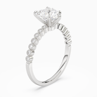 Heart Accent Shoulder Solitaire in 18K White Gold angled