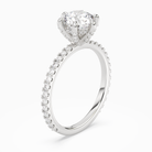 Round Hidden Halo Accent Six-Prong Pavé in Platinum angled