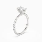 Oval Hidden Halo Accent Luxe Pavé in 18K White Gold angled