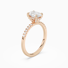 Oval Hidden Halo Accent Petite Pavé in 14K Rose Gold angled