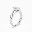Emerald Wide Tapered Bezel Solitaire in Platinum angled