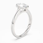 Oval Medium Tapered Bezel Solitaire in Platinum angled