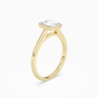 Emerald Slim Tapered Bezel Solitaire in 14K Yellow Gold angled