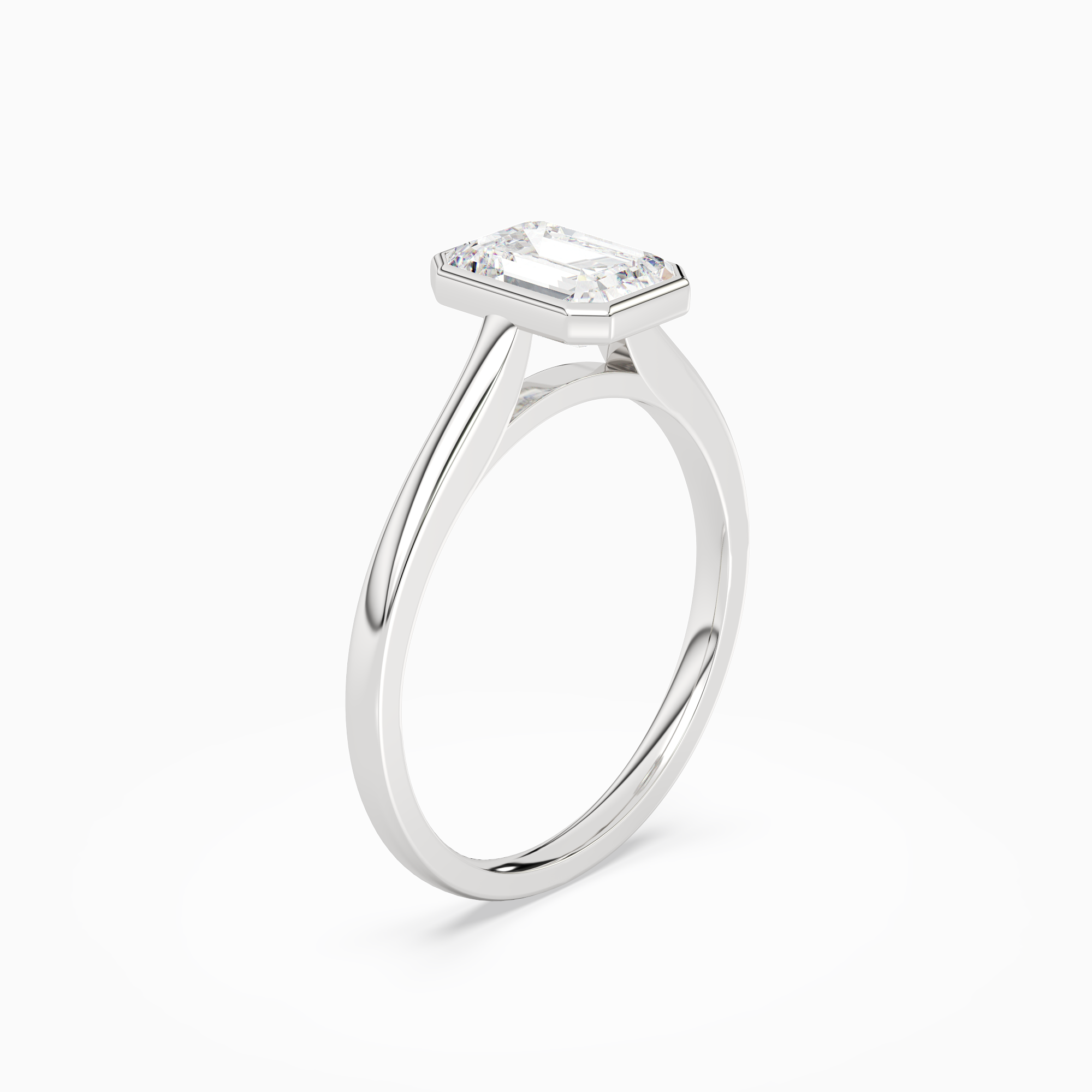 Emerald Slim Tapered Bezel Solitaire in Platinum angled