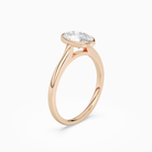 Oval Slim Tapered Bezel Solitaire in 14K Rose Gold angled