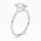 Oval Slim Tapered Bezel Solitaire in Platinum angled