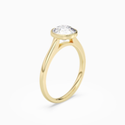 Round Slim Tapered Bezel Solitaire in 14K Yellow Gold angled