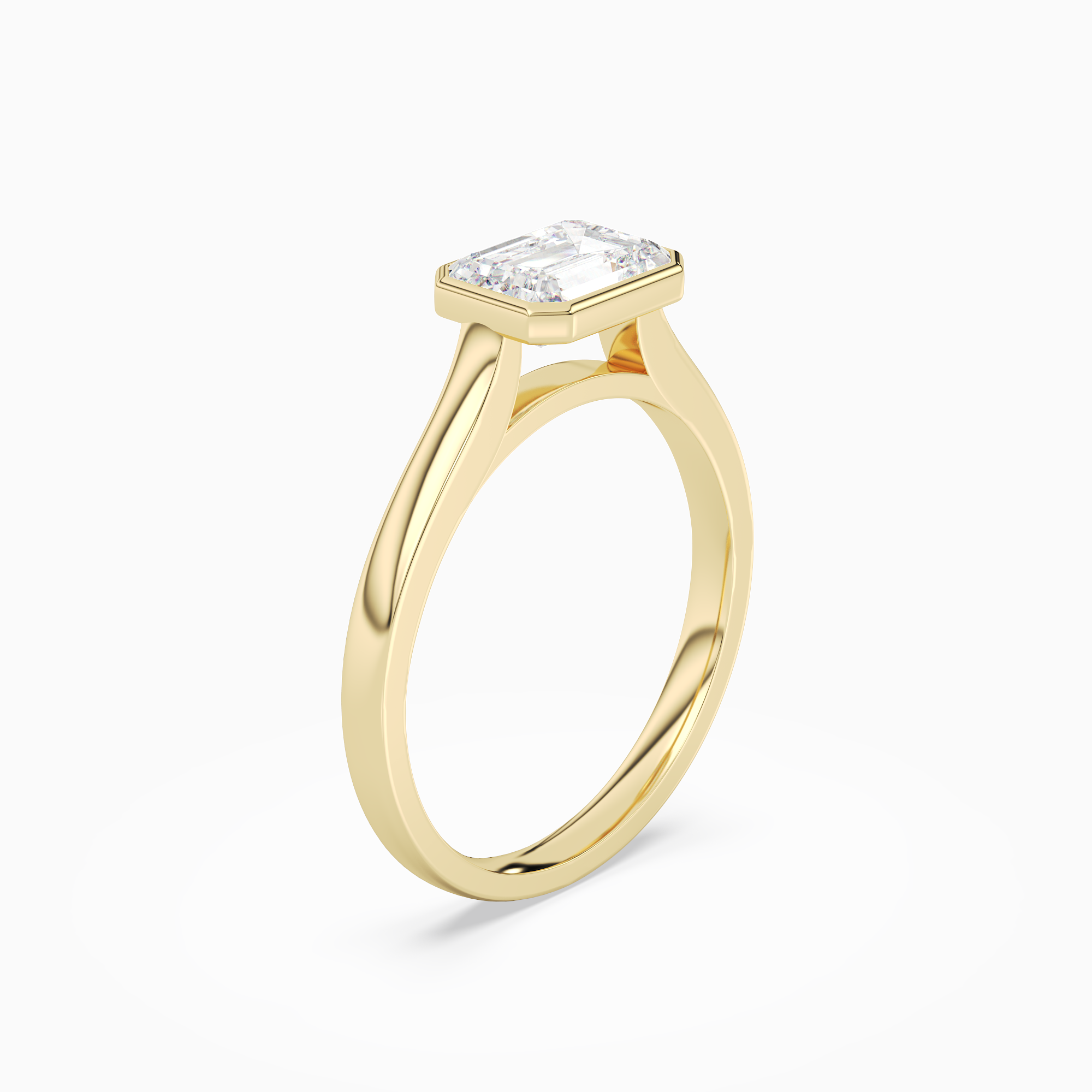 Emerald East-West Bezel Solitaire in 14K Yellow Gold angled