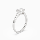 Emerald East-West Bezel Solitaire in 18K White Gold angled