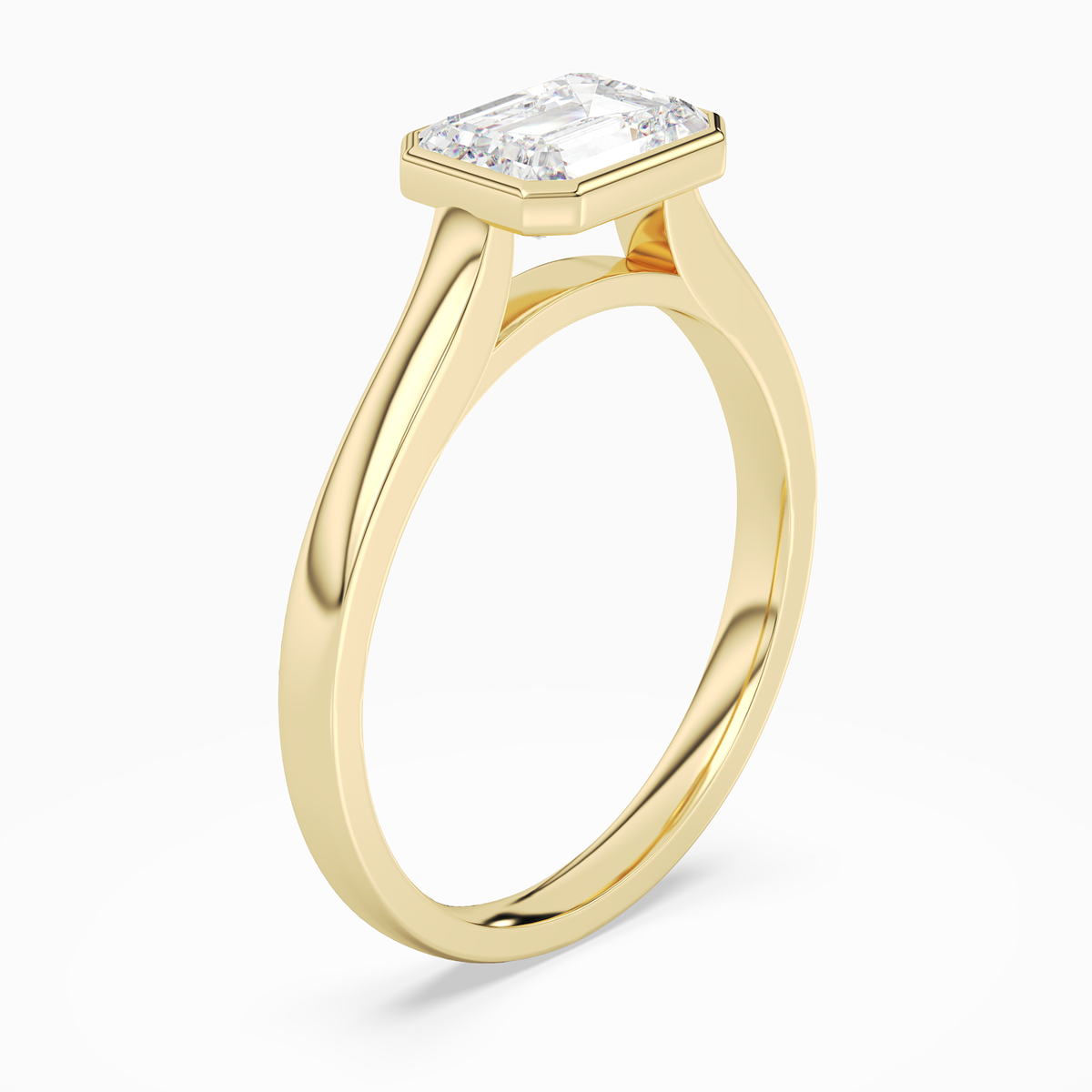 Emerald East-West Bezel Solitaire in 18K Yellow Gold angled