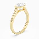 Oval East-West Bezel Solitaire in 14K Yellow Gold angled