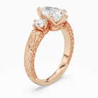 Pear Engraved Vintage Three Stone in 14K Rose Gold angled