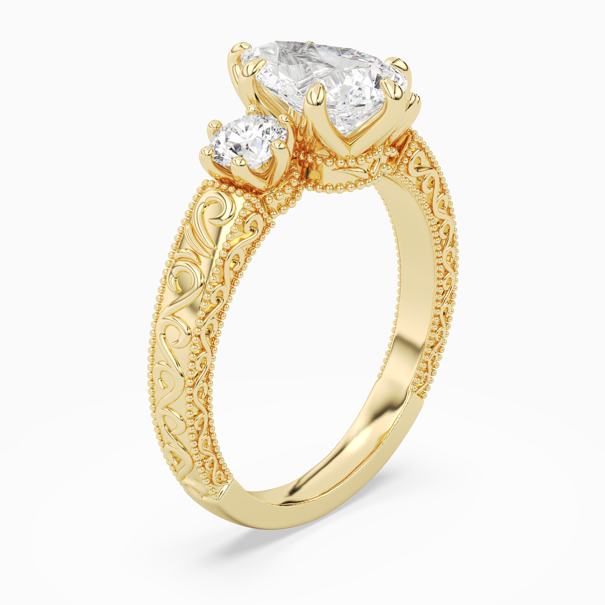 Pear Engraved Vintage Three Stone in 14K Yellow Gold angled