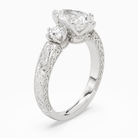 Pear Engraved Vintage Three Stone in Platinum angled