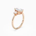 Pear Classic Round Three Stone Large Sides in 14K Rose Gold angled